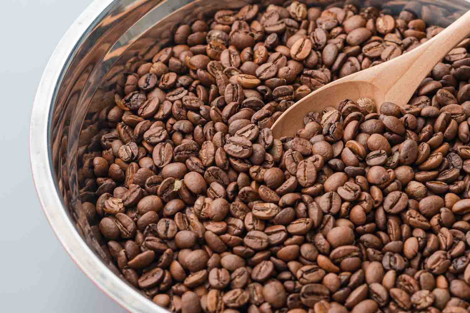 Hands-on coffee roasting process – selecting green beans, monitoring roast profiles, and achieving the perfect roast.