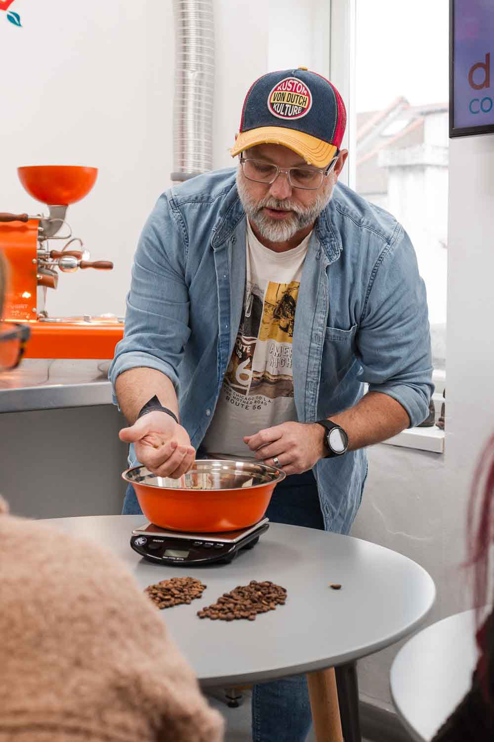 Hands-on coffee roasting process – selecting green beans, monitoring roast profiles, and achieving the perfect roast.