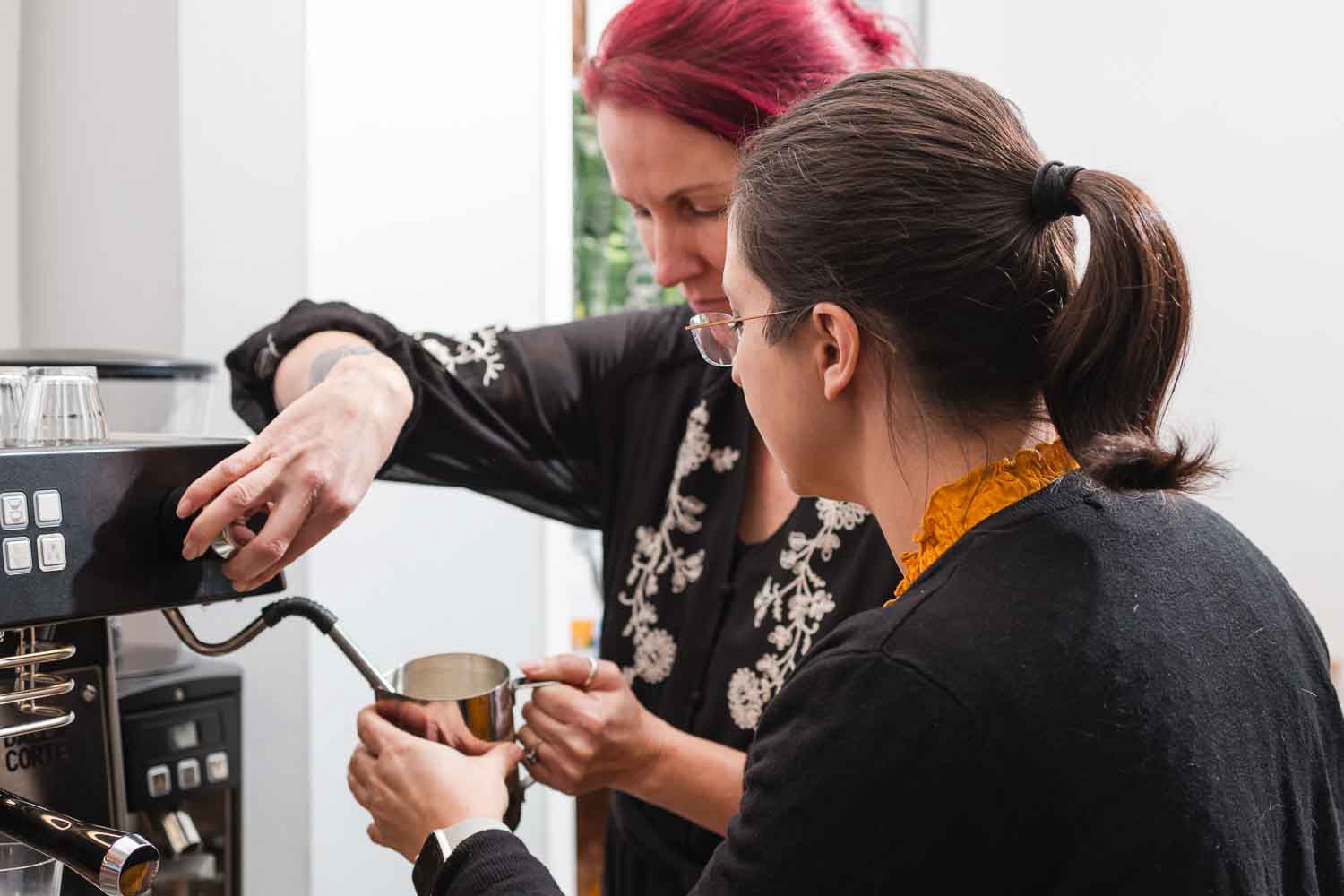 Barista training: hands-on learning and coffee craftsmanship in action.