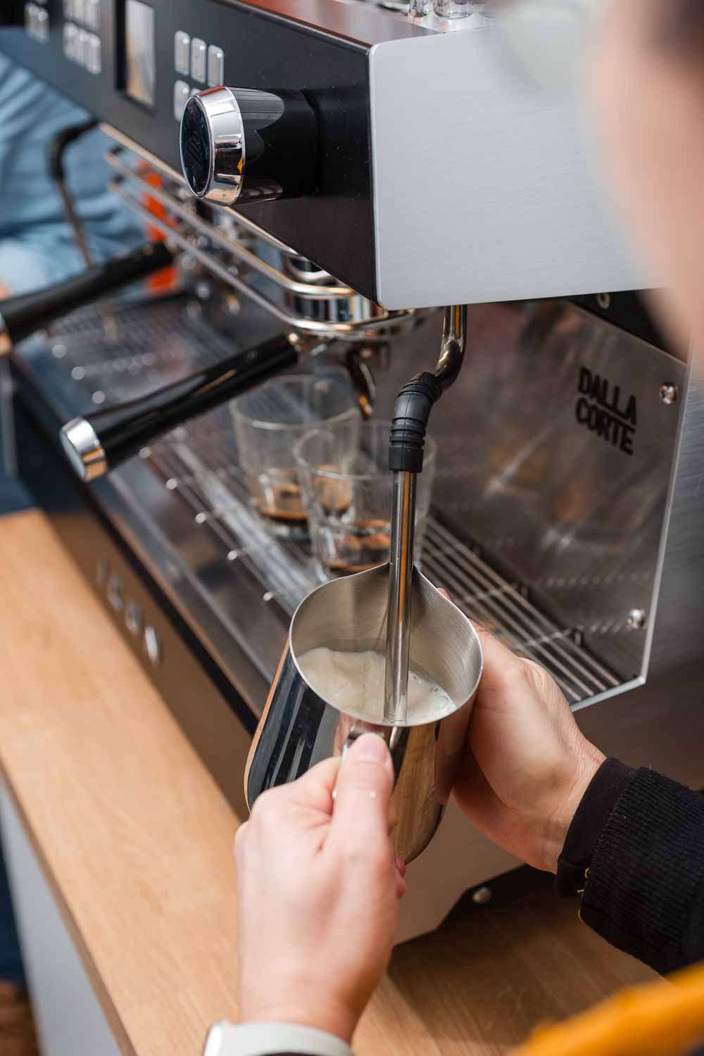 Barista training: hands-on learning and coffee craftsmanship in action.